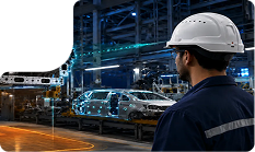 Worker in a white hard hat on an automotive assembly line